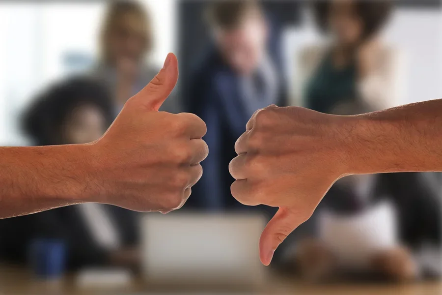 People with thumbs up and thumbs down