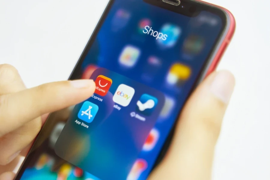 Person about to open AliExpress on an iPhone