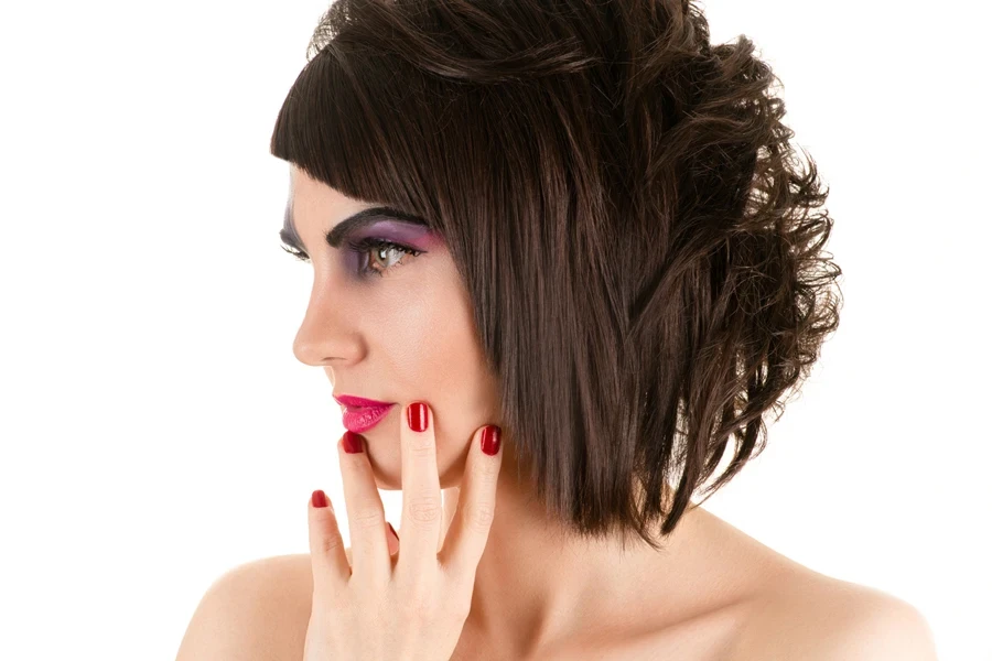 Side profile of young woman with choppy bixie cut