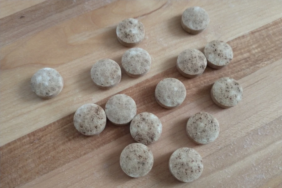 Small batches of shower steamers on wooden floor