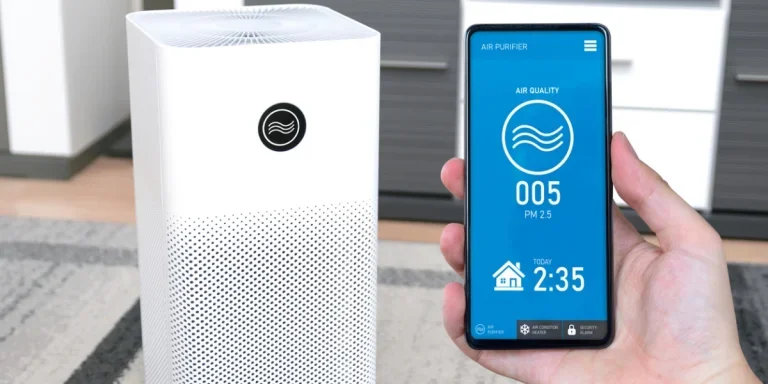 Someone holding a mobile phone to control a smart air purifier