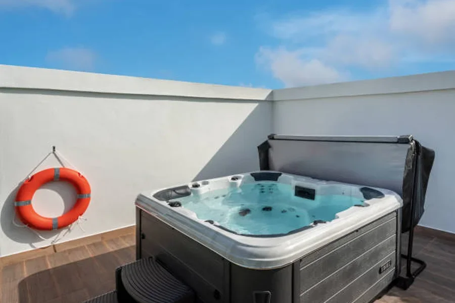 Spa with a rigid hot tub cover