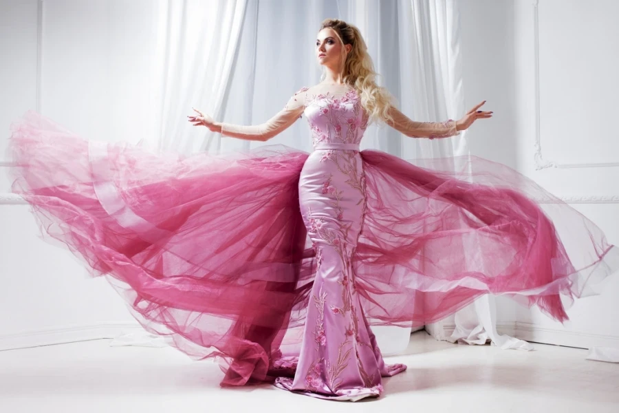 Stunning woman wearing a floral baby pink dress