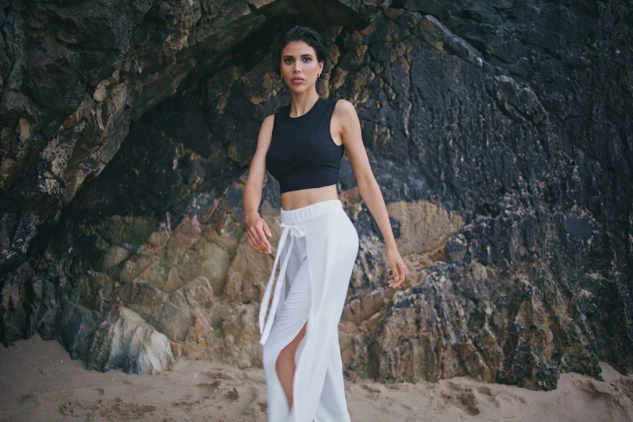 Stylish girl in trendy drawstring pants and black top