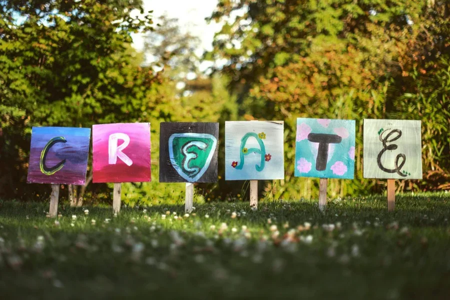 The word “WORD” spelled out on boards in a yard