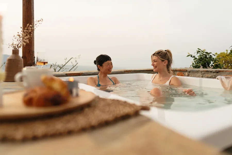 Two friends relaxing in a hot tub