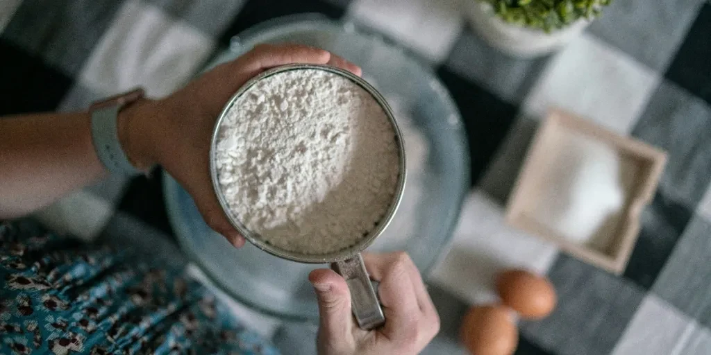 Woman holding a flour sifter