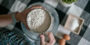 Woman holding a flour sifter