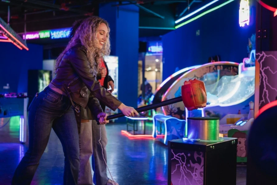 Woman in a cropped jacket playing hammer strike