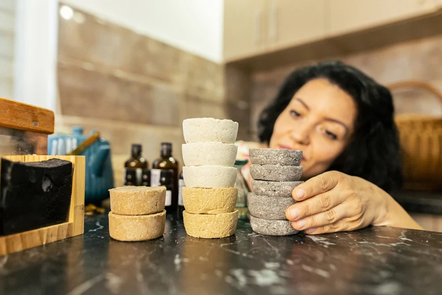 Woman making homemade shower steamers with different fragrances
