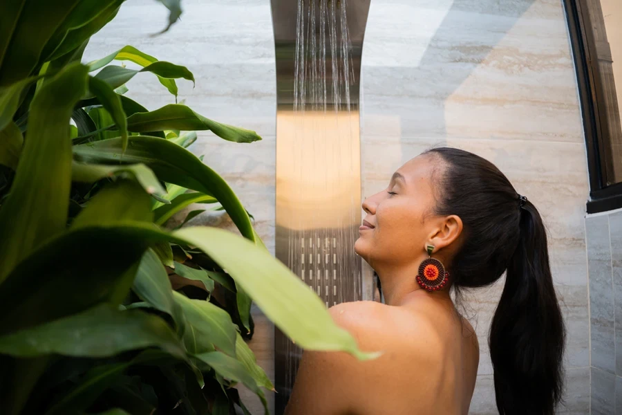 Woman using eucalyptus shower steamer with menthol crystals
