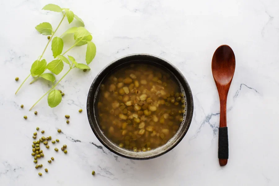 Wooden spoon next to a soup bowl