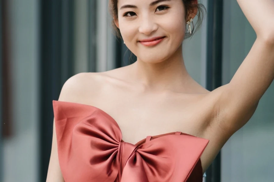 Young beauty in an off shoulder bow dress