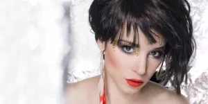 Young woman with bixie haircut and bright red lipstick