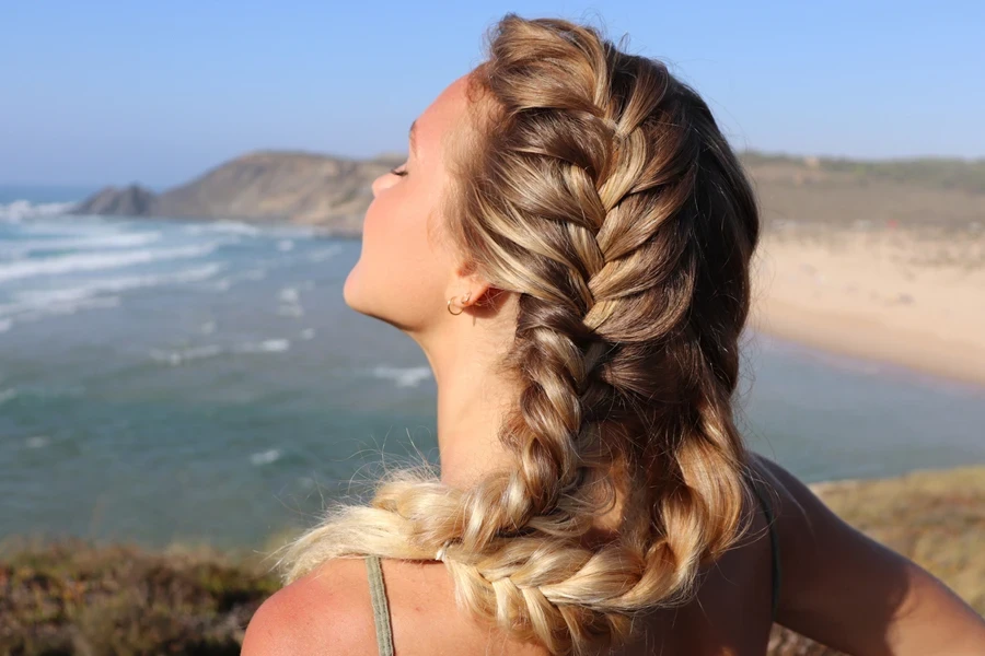 Young woman with side Dutch braid at the beach