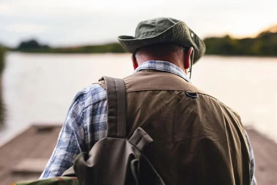 A Man Enjoying a Peaceful Fishing Trip by the Lake