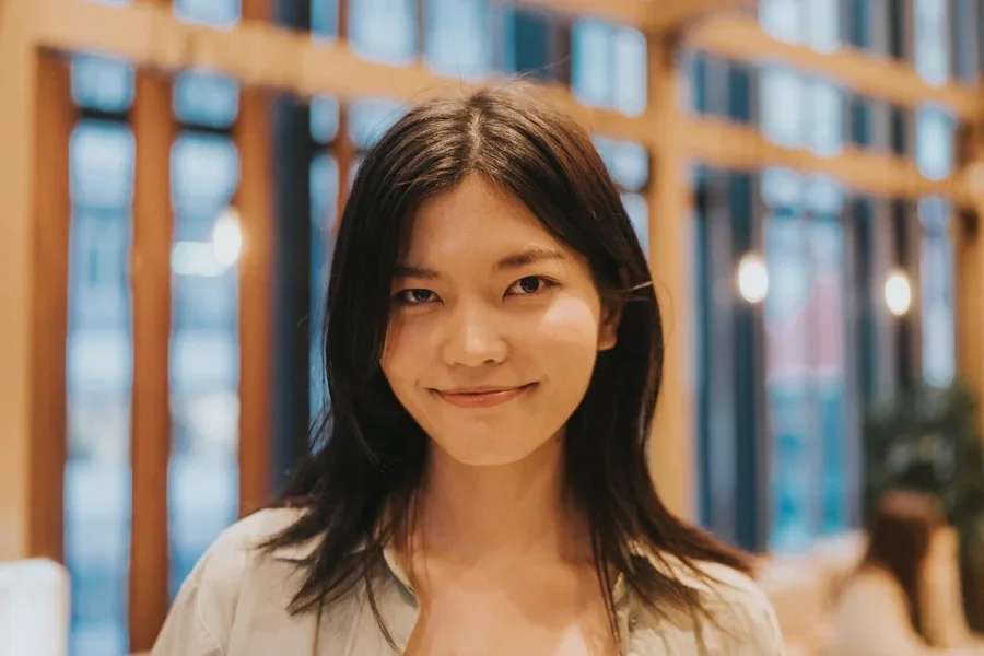 A Woman In A Cafe Smiling