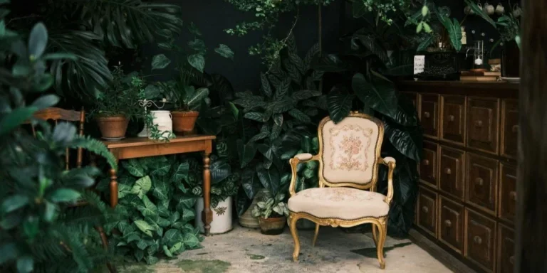 A chair sitting in front of a plant-filled wall