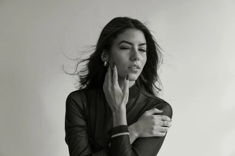 A female model wearing ear cuffs and other cool jewelry