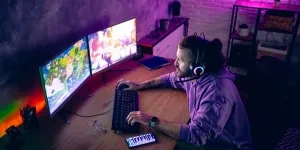 A man using a curved gaming monitor