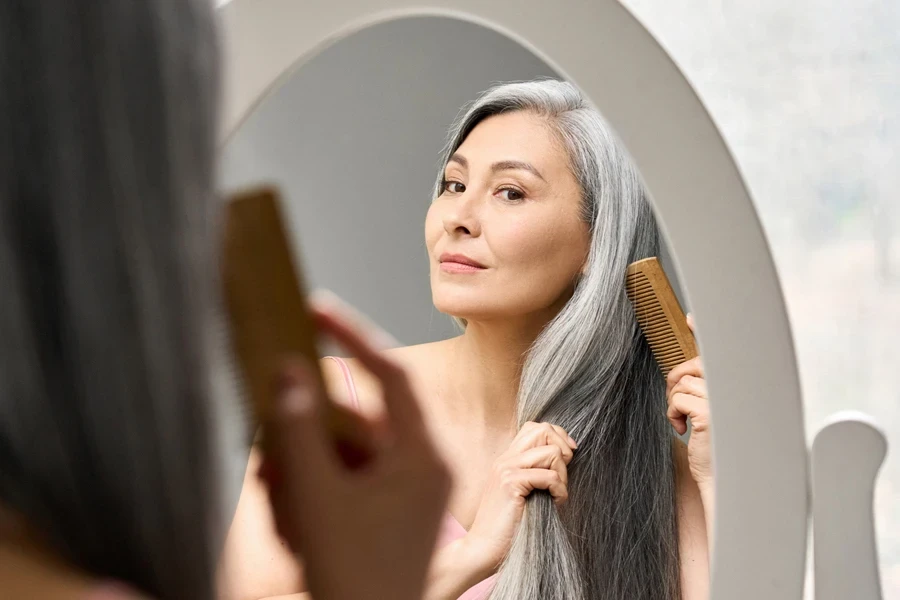 A middle-aged woman combing her hair