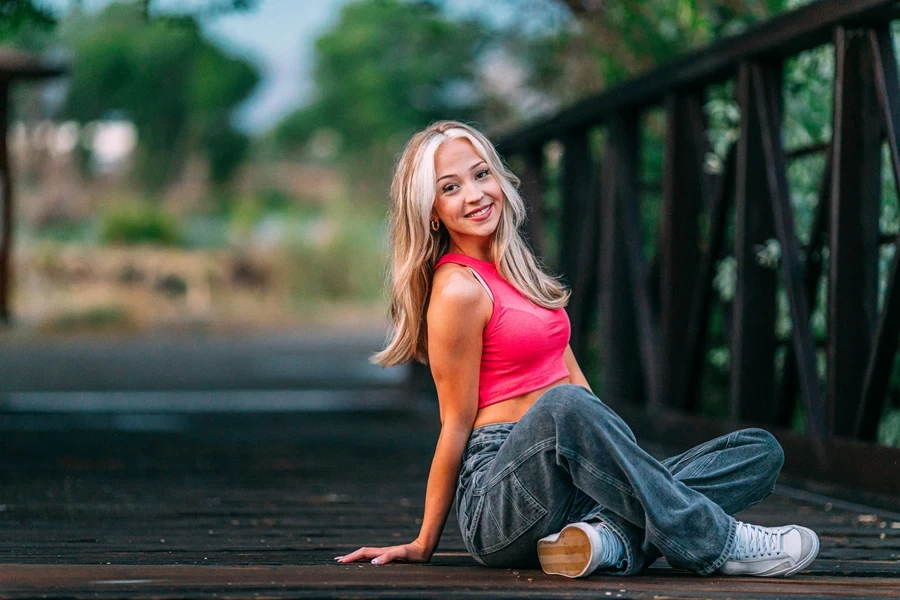A person sitting on a bridge