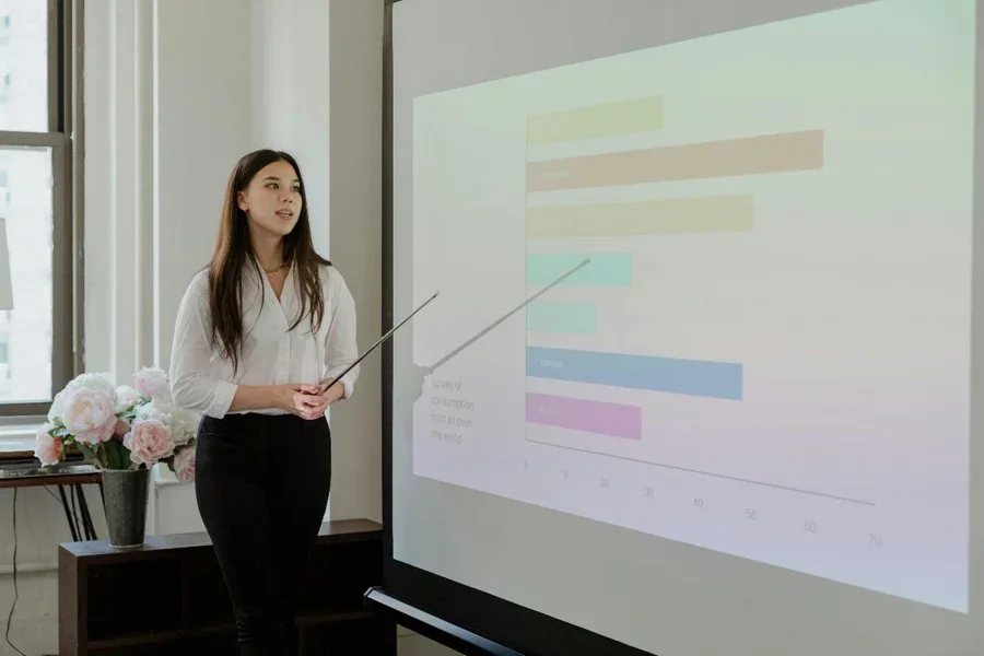 A person standing in front of a projection screen