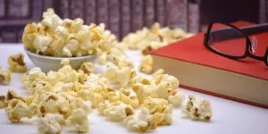 A pile of popcorn and a book