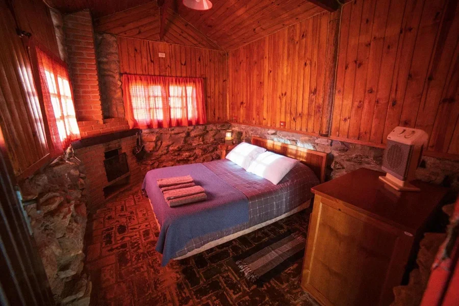 A room with a bed and a dresser