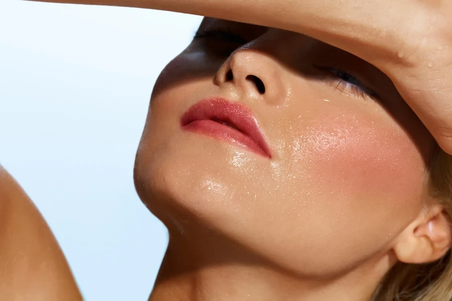 A sweaty woman with makeup