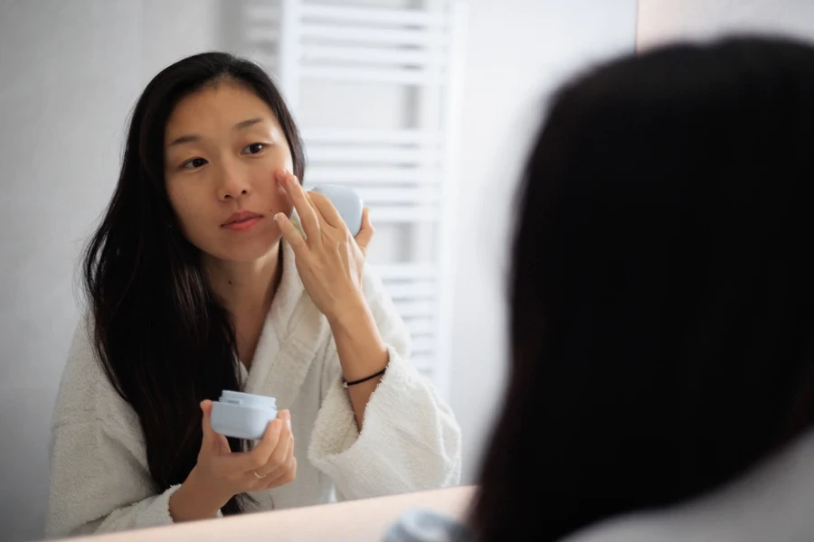 A woman doing her beauty routine