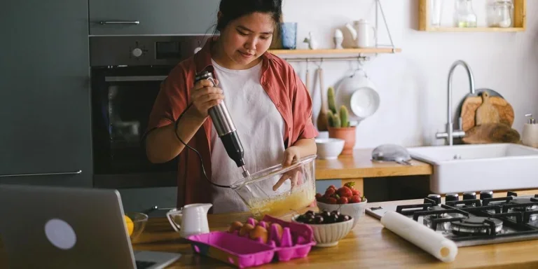 A woman in the kitchen baking