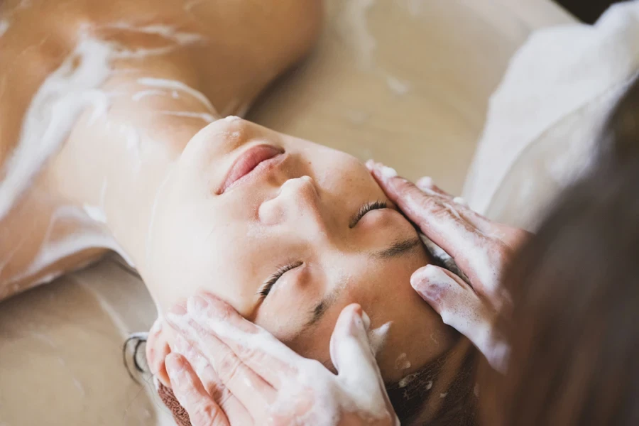 A woman receiving Japanese facial massage