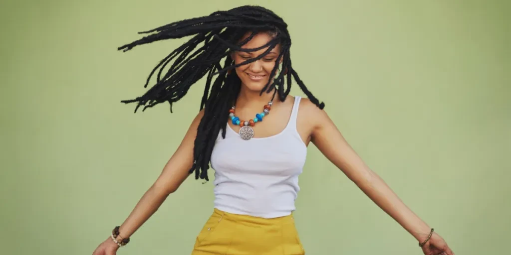 A women with long wicks locs