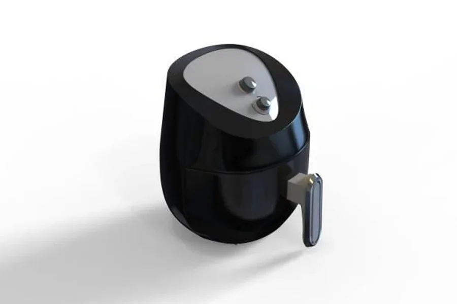 Аэрофритюрница черного цвета, установленная на кухонной стойке.