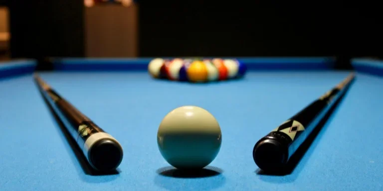 Billiard Table with Cue Sticks on Top