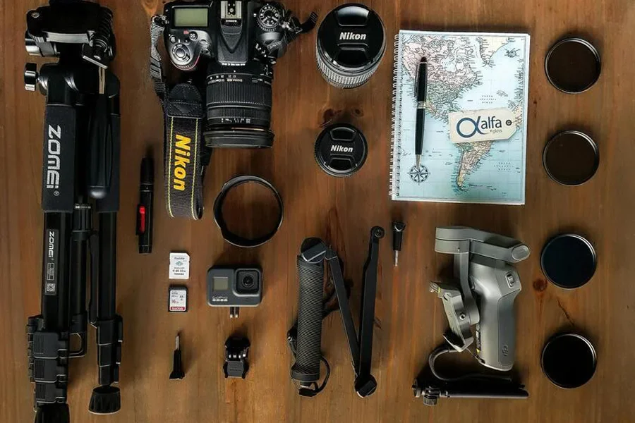 Black camera with accessories on a table