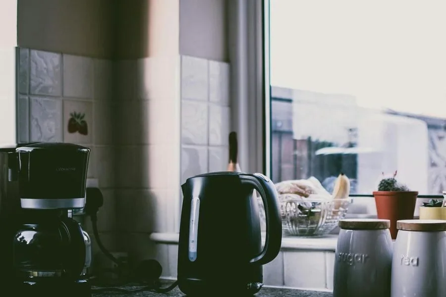 Black coffee maker on a kitchen counter