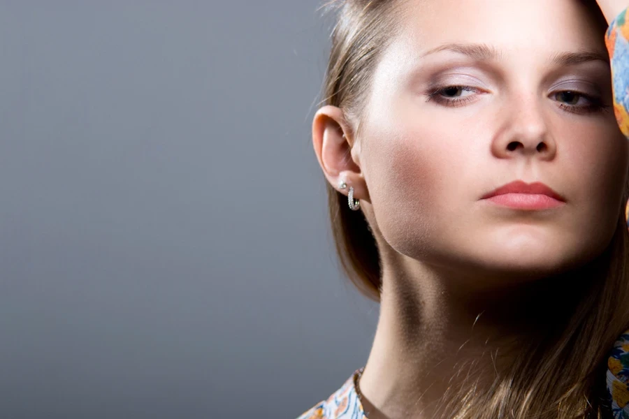 Close-up of a woman wearing silver ear cuffs