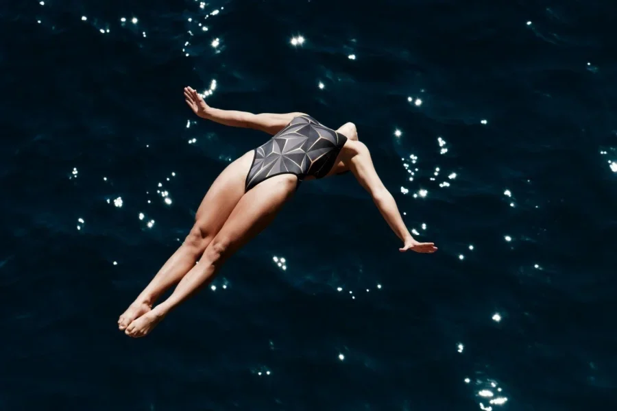 Fearless Woman Diving into Ocean Waters