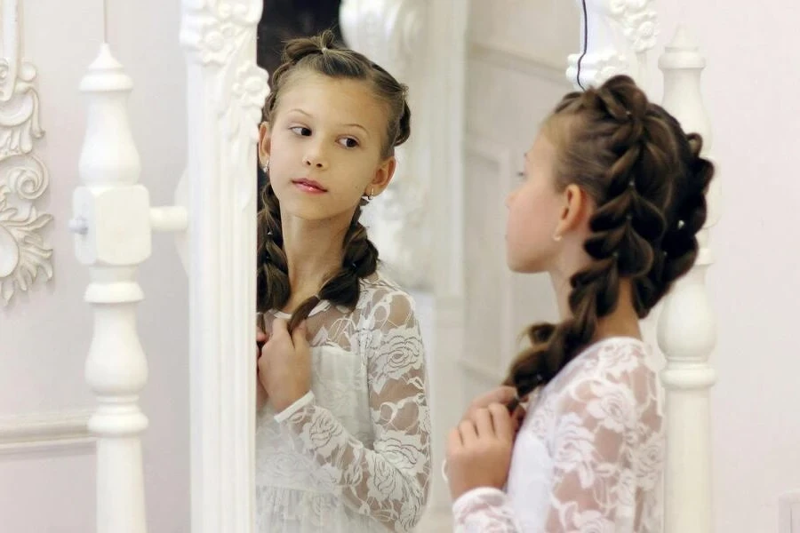 Girl looking at herself in a mirror