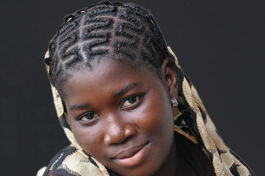 Girl with intricate cornrow braids