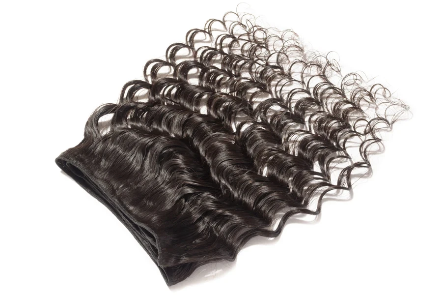 Image of black, curly clip-in extensions