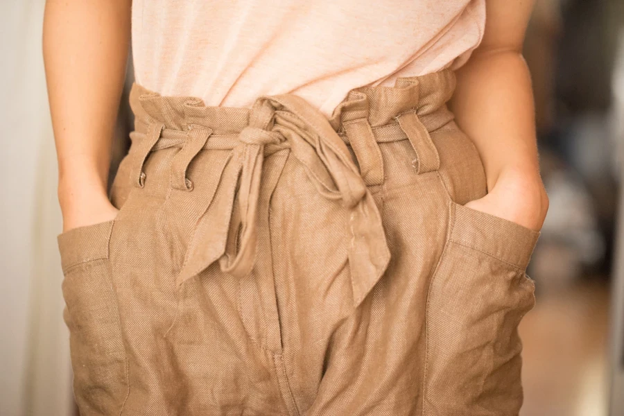 Lady wearing a paper bag tapered waist pant