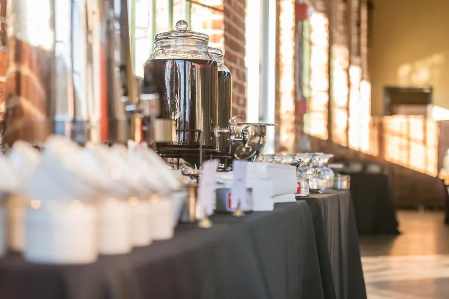 Large coffee dispensers on a breakfast table