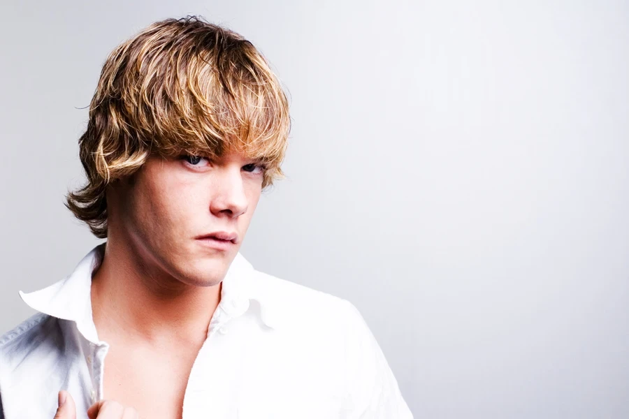 Man with blond hair and textured mod haircut