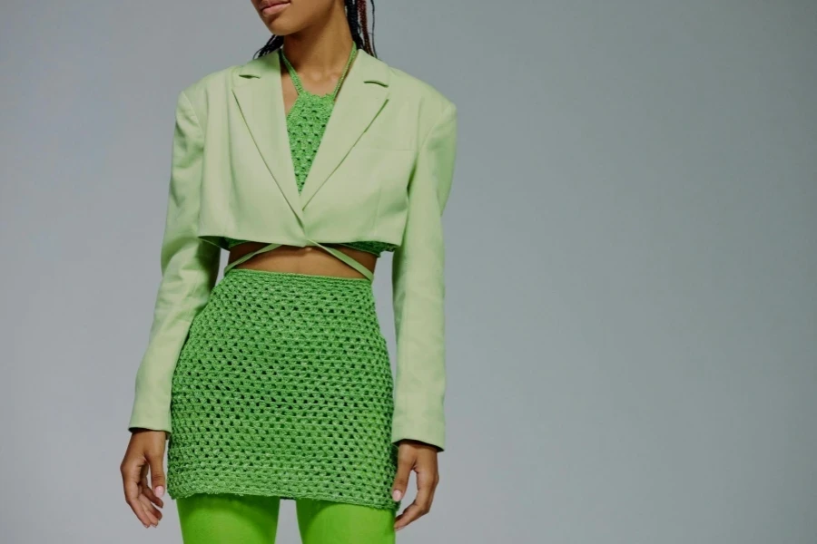 Midsection of woman in green clothing
