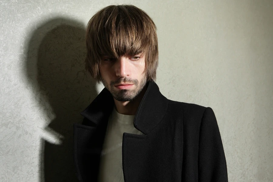 Moody many with stylish mod cut and dark beard