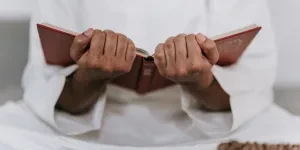 Person Holding a Quran