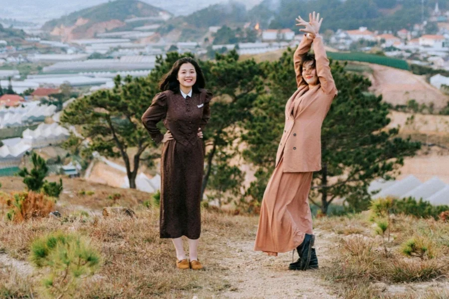 Shallow Focus Photo of Women Standing on Grass